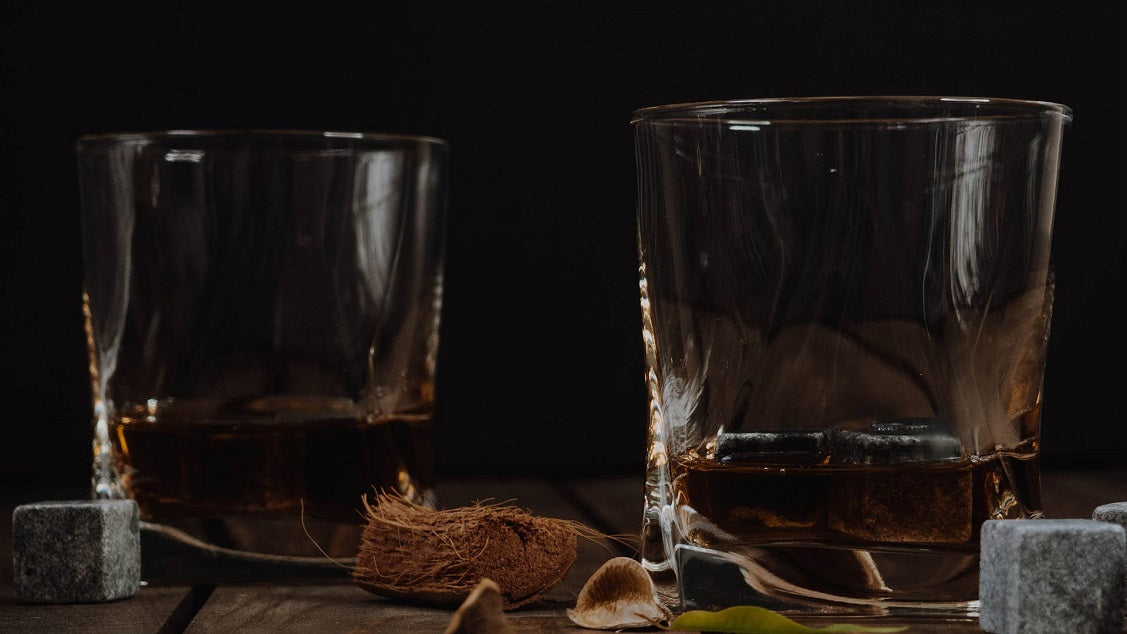 Two whisky glasses with stones
